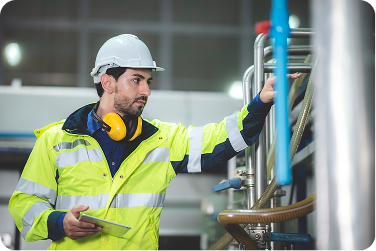 Maintenance leader inspecting equipment