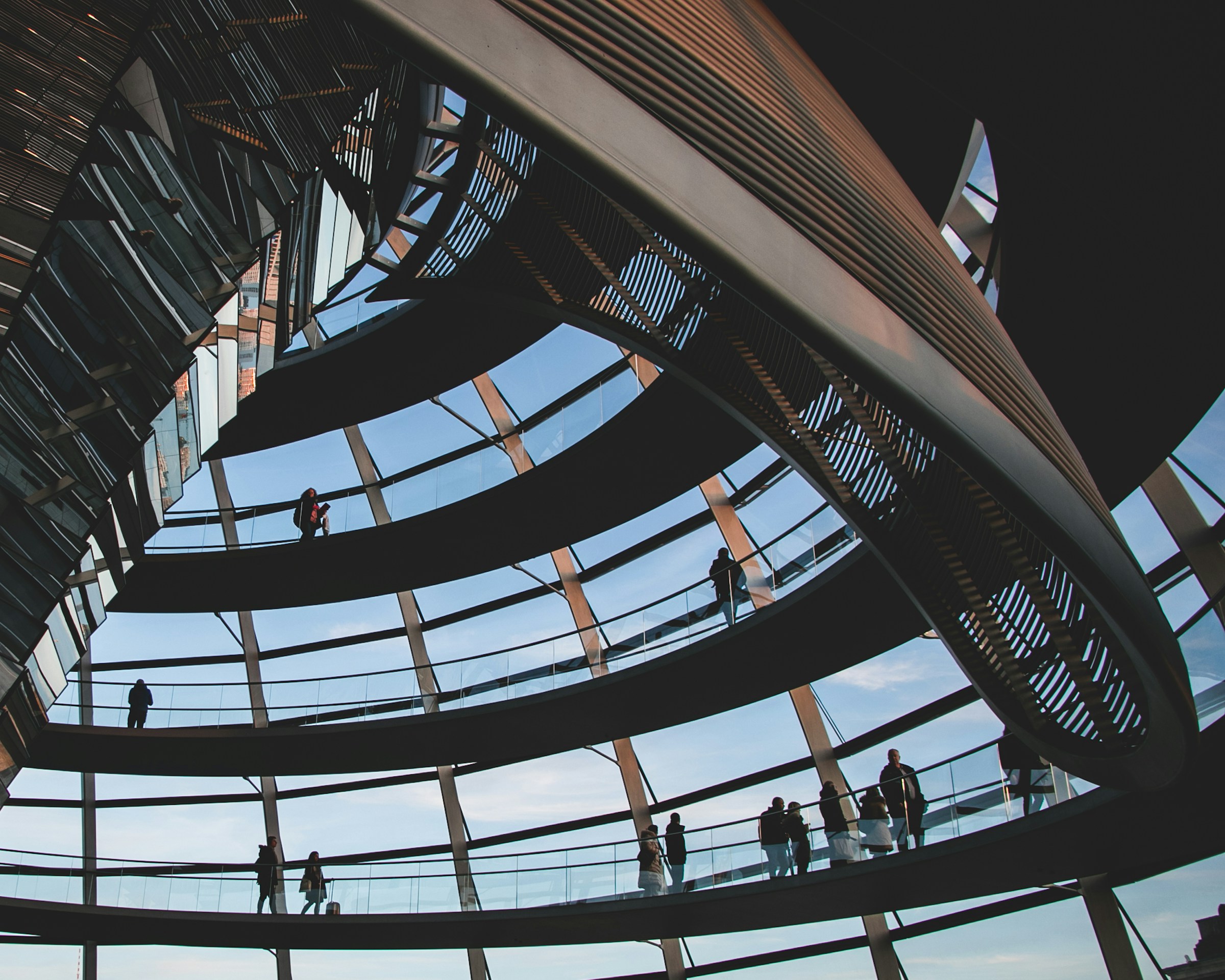 Glass dome interior with spiral walkways and people