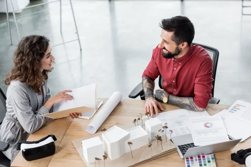 two employees collaborating in office space