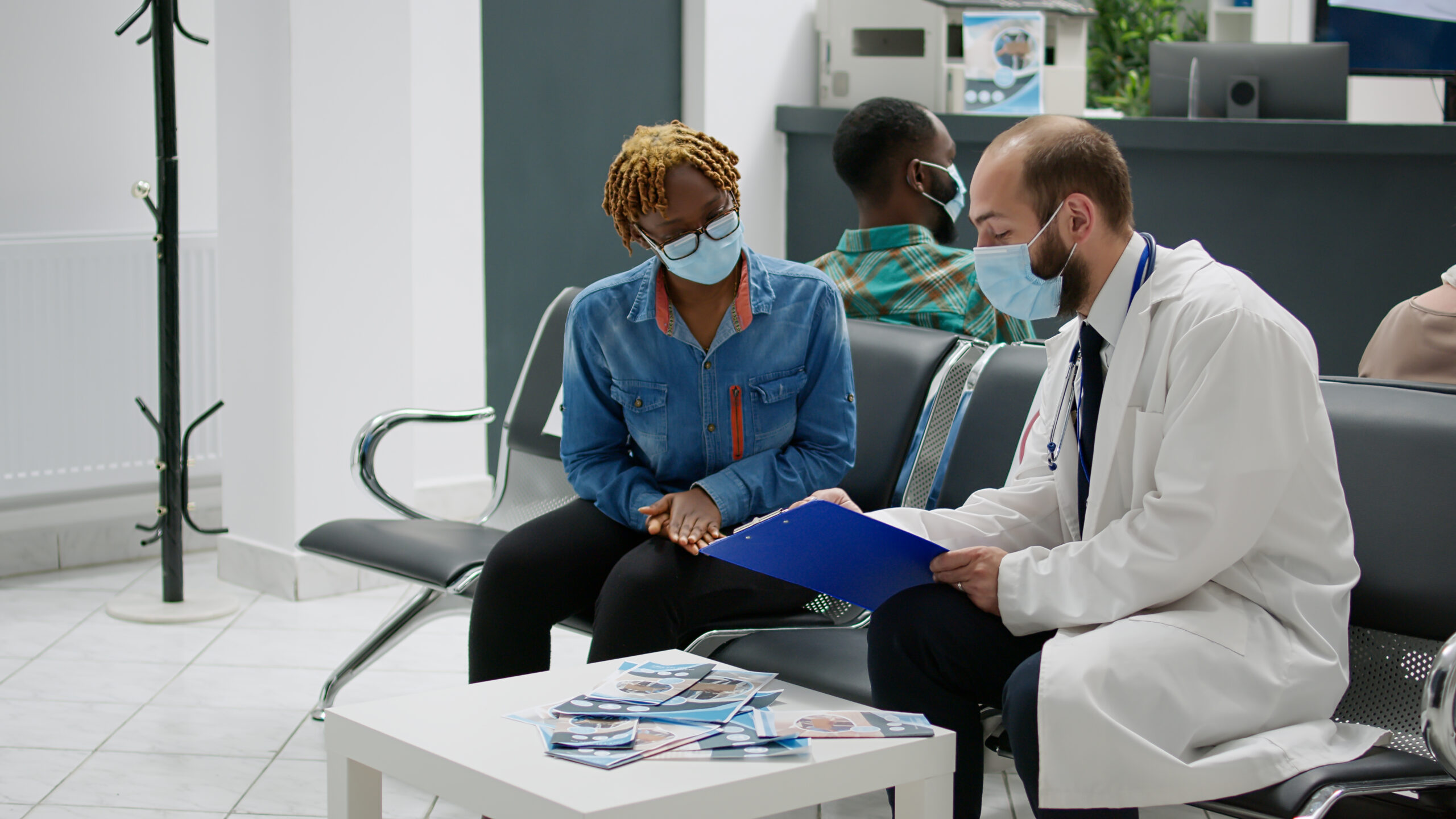 woman talking with a physician in an office